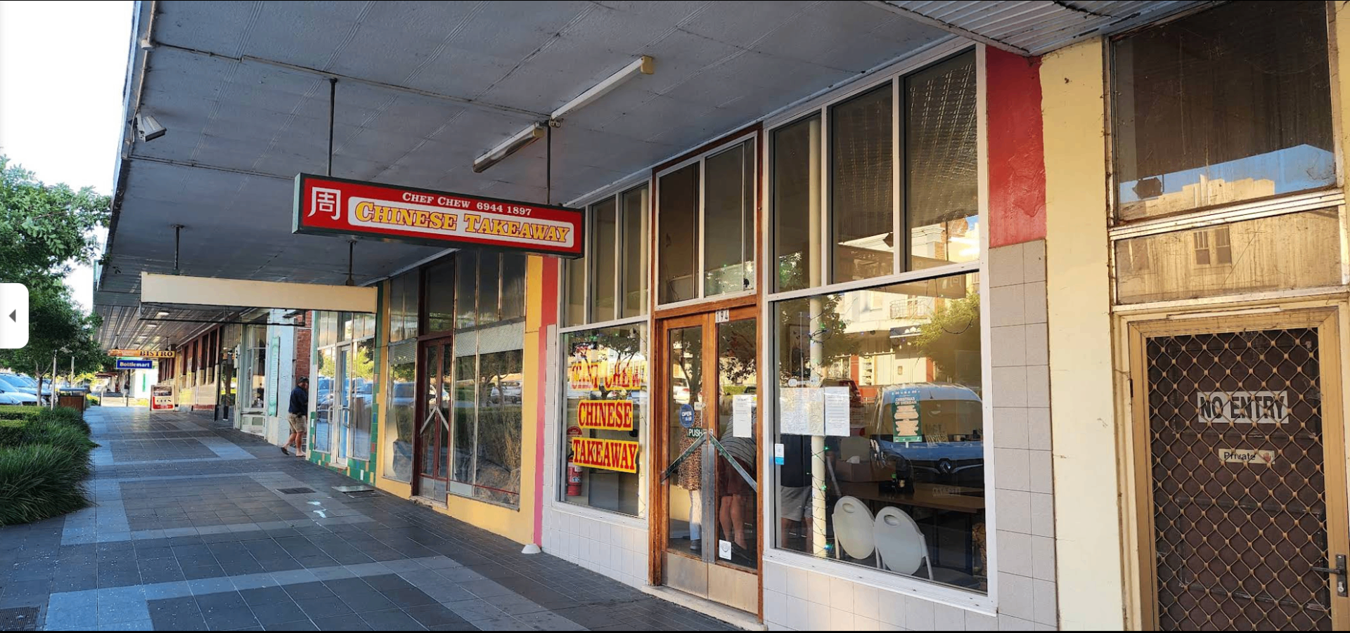 Side view of Chef Chew shopfront with the 周 sign